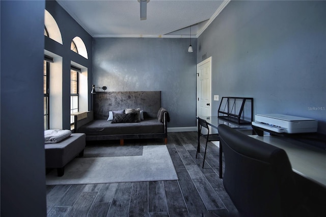 living area with dark wood-style floors, baseboards, and ornamental molding