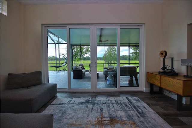 doorway featuring a healthy amount of sunlight and baseboards