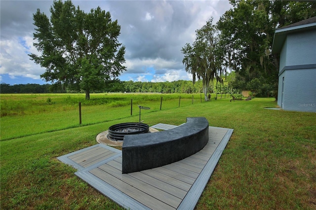 view of yard with a fire pit