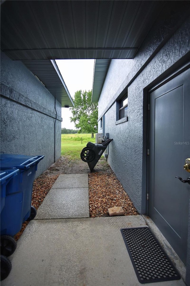 view of property exterior featuring a lawn and stucco siding