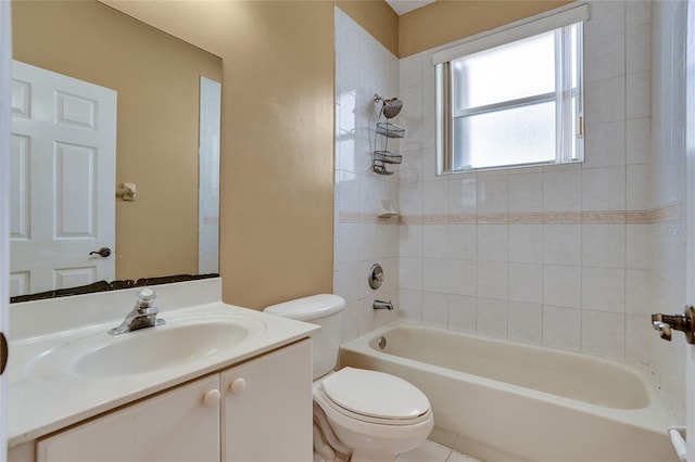 bathroom featuring washtub / shower combination, vanity, and toilet