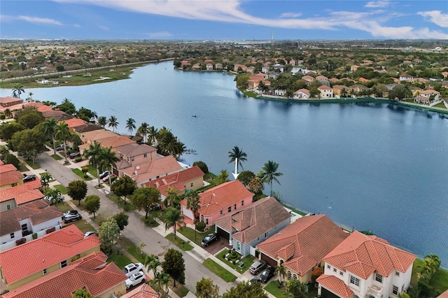 birds eye view of property with a residential view and a water view