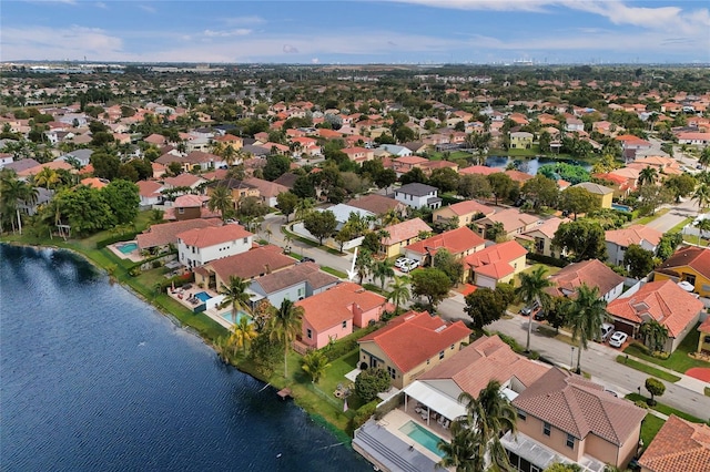 aerial view with a residential view and a water view