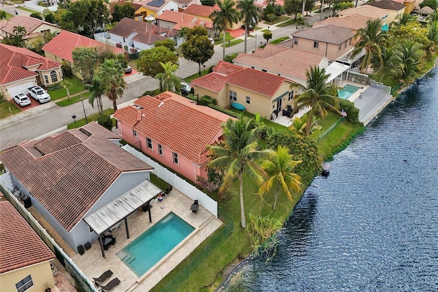 birds eye view of property with a residential view and a water view