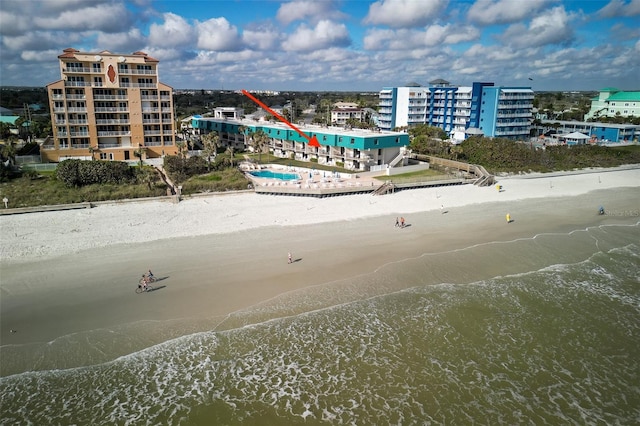 aerial view with a water view, a view of city, and a view of the beach