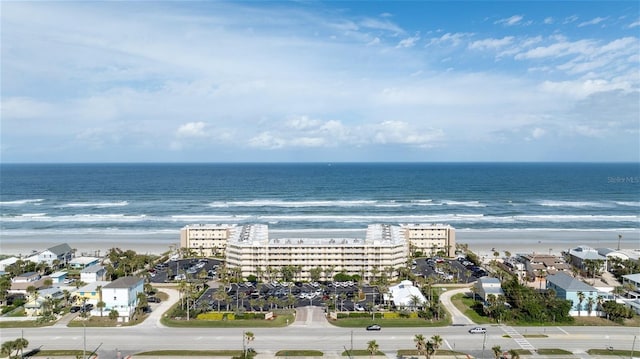 bird's eye view with a water view, a beach view, and a city view