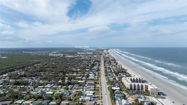 aerial view featuring a water view and a view of the beach