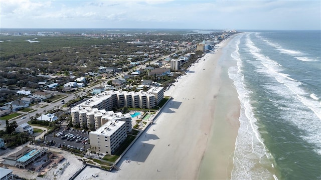 aerial view with a water view, a beach view, and a city view