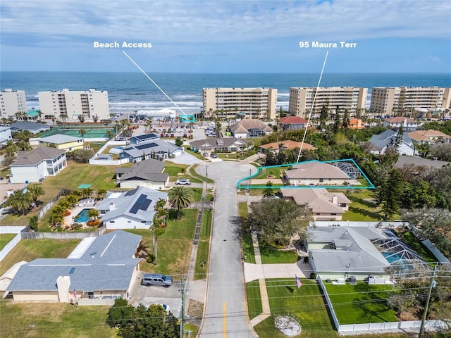 drone / aerial view featuring a water view and a city view