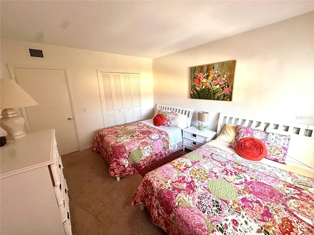 bedroom with carpet, visible vents, and a closet