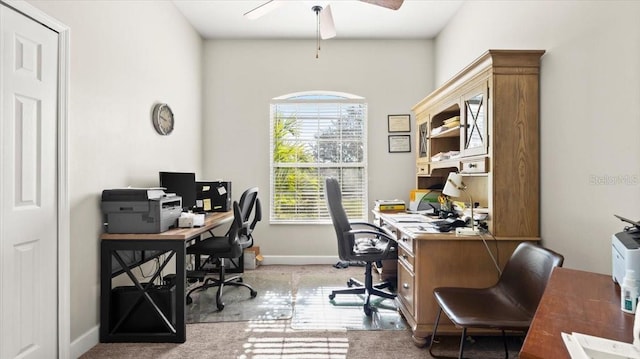 office area featuring ceiling fan and baseboards