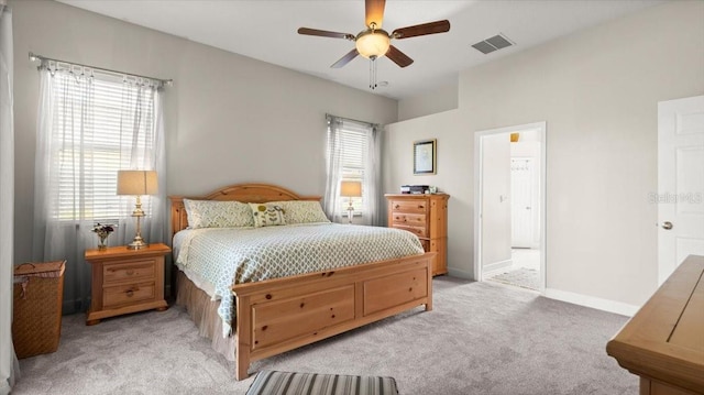 bedroom featuring light carpet, baseboards, visible vents, and ceiling fan