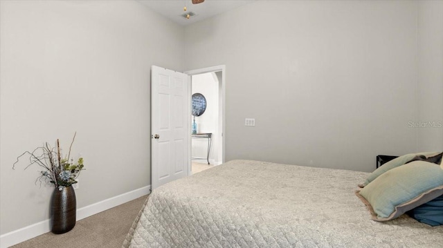 bedroom featuring ceiling fan, carpet, and baseboards