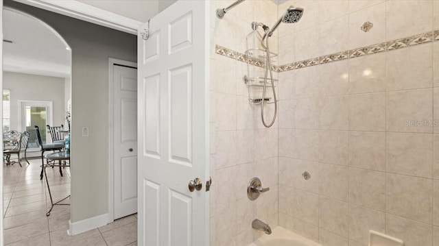 full bath featuring shower / bathtub combination, tile patterned flooring, and baseboards