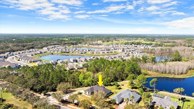 birds eye view of property with a residential view and a water view