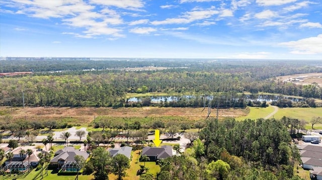 bird's eye view featuring a water view, a residential view, and a wooded view