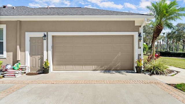 garage featuring driveway