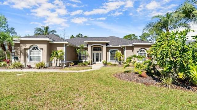 single story home featuring a front lawn and stucco siding