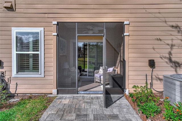 doorway to property with central AC unit