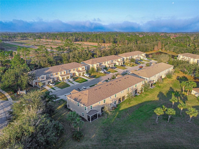 bird's eye view with a residential view and a view of trees