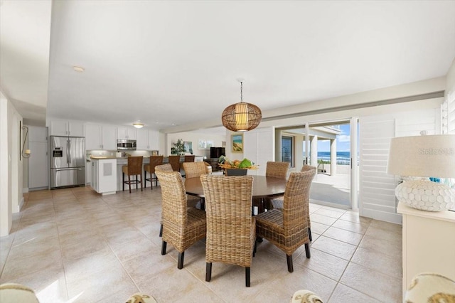 dining space featuring light tile patterned floors