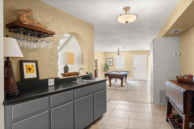 reception area featuring billiards, visible vents, and a sink