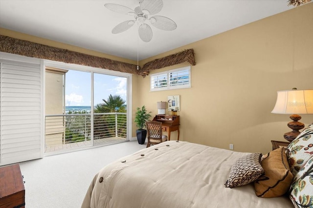 carpeted bedroom featuring access to outside and a ceiling fan