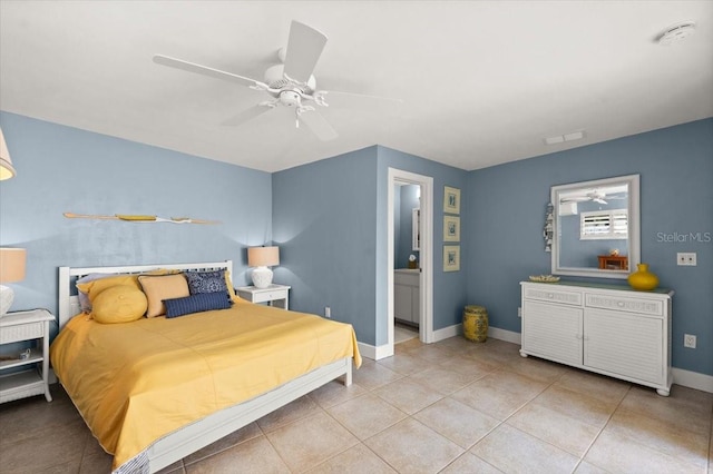 bedroom featuring a ceiling fan, baseboards, and light tile patterned floors