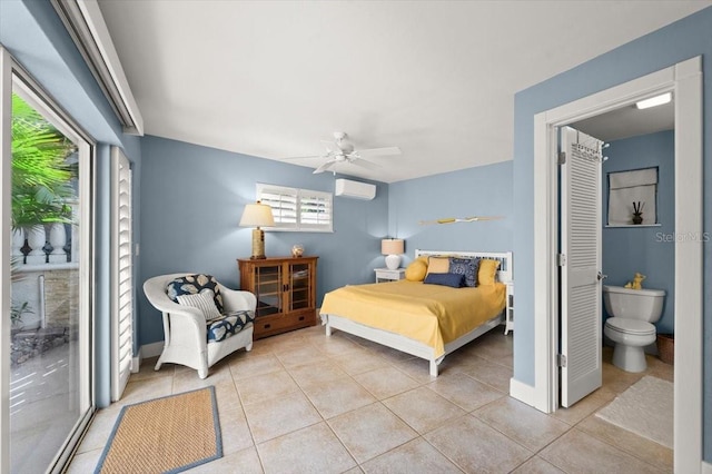 bedroom with a ceiling fan, tile patterned flooring, a wall unit AC, and baseboards