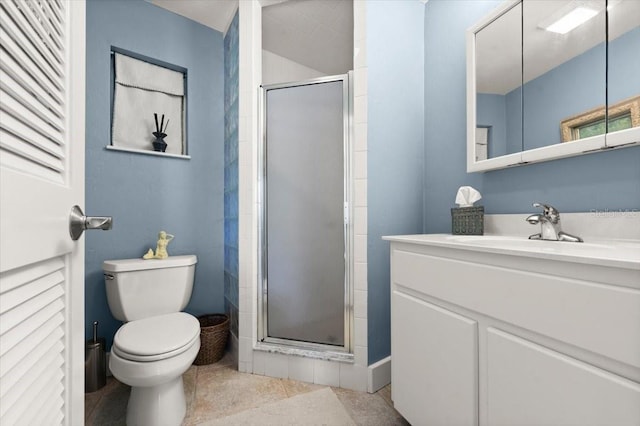 full bathroom with a stall shower, vanity, toilet, and tile patterned floors