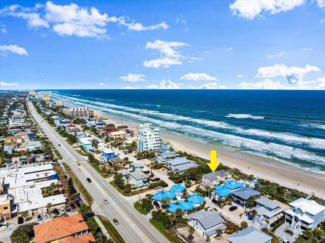 bird's eye view with a view of the beach and a water view