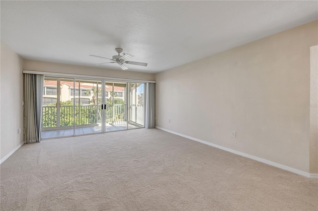 407 Bouchelle Dr Unit 205, New Smyrna Beach, FL 32169 - carpeted spare room featuring a ceiling fan and baseboards