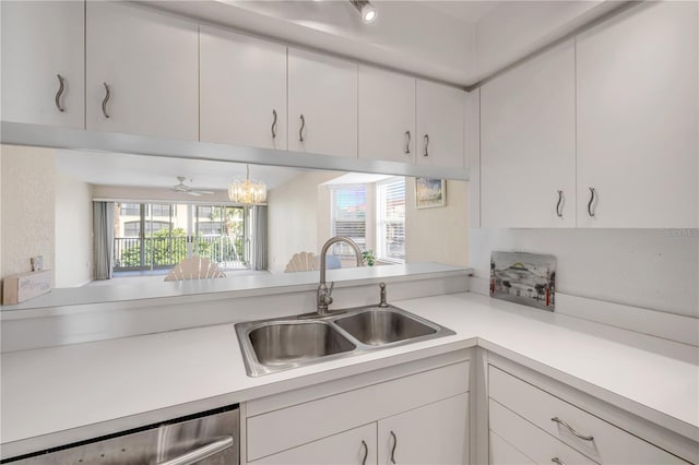 407 Bouchelle Dr Unit 205, New Smyrna Beach, FL 32169 - kitchen featuring dishwasher, white cabinetry, light countertops, and a sink