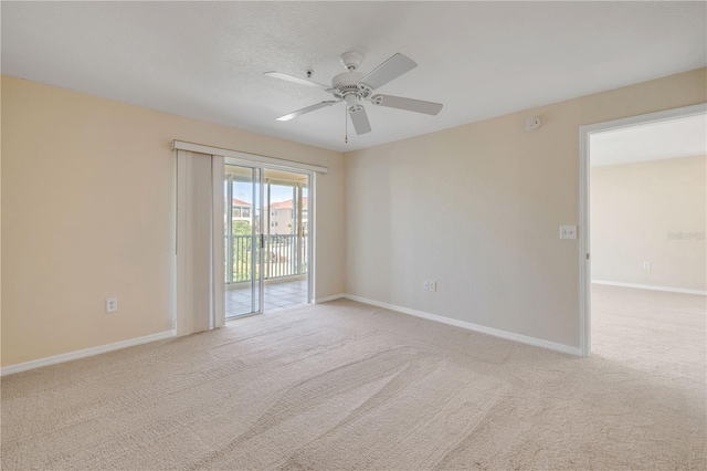 407 Bouchelle Dr Unit 205, New Smyrna Beach, FL 32169 - carpeted spare room with a ceiling fan and baseboards