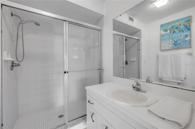 407 Bouchelle Dr Unit 205, New Smyrna Beach, FL 32169 - full bath featuring a stall shower, visible vents, and vanity