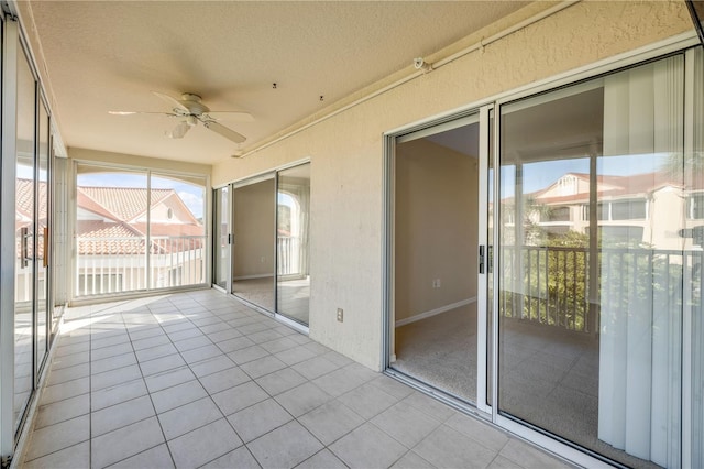 407 Bouchelle Dr Unit 205, New Smyrna Beach, FL 32169 - unfurnished sunroom featuring ceiling fan