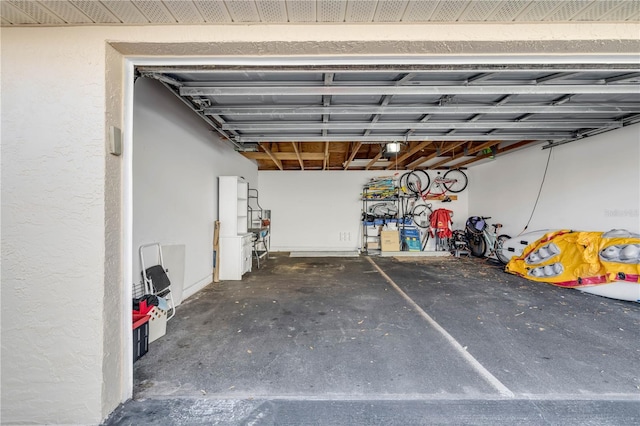407 Bouchelle Dr Unit 205, New Smyrna Beach, FL 32169 - garage featuring a garage door opener