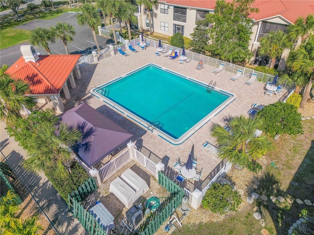 407 Bouchelle Dr Unit 205, New Smyrna Beach, FL 32169 - pool featuring a patio area and fence