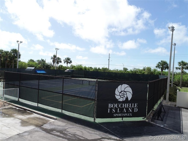 407 Bouchelle Dr Unit 205, New Smyrna Beach, FL 32169 - view of sport court featuring fence