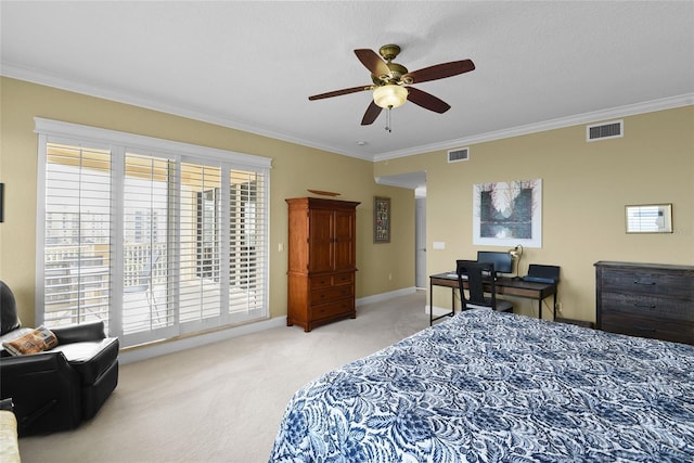 carpeted bedroom with visible vents, baseboards, and crown molding