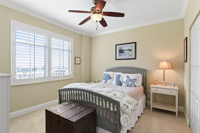 bedroom with baseboards, a ceiling fan, ornamental molding, and carpet flooring