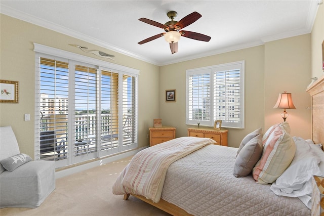 carpeted bedroom featuring a ceiling fan and ornamental molding