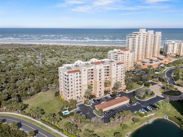 birds eye view of property with a city view, a view of the beach, and a water view