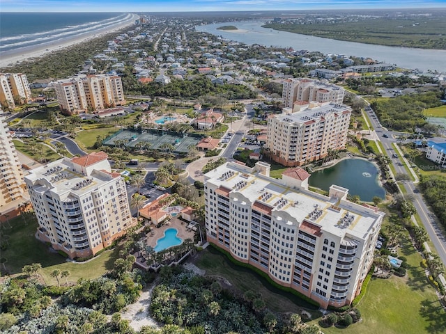 birds eye view of property featuring a view of city and a water view