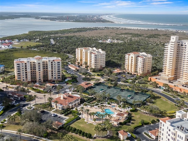 birds eye view of property featuring a view of city and a water view