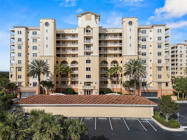 view of property featuring uncovered parking