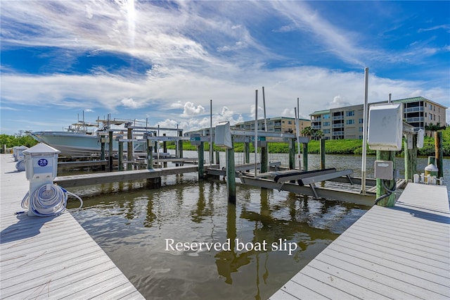 view of dock featuring a water view and boat lift