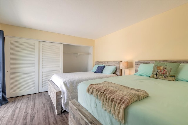 bedroom with a closet and wood finished floors