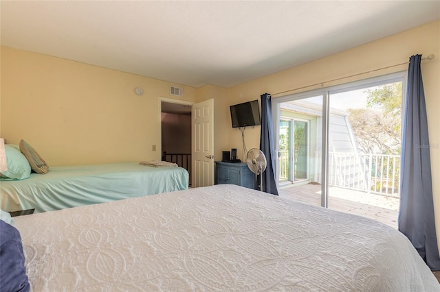 bedroom with access to outside and visible vents