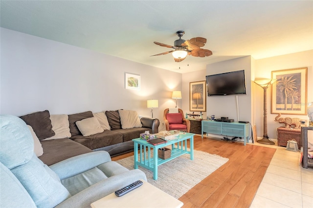 living room with ceiling fan and light wood finished floors